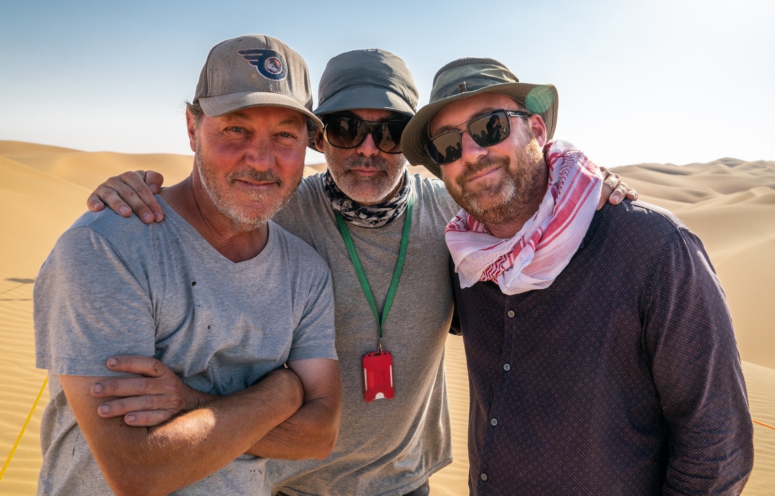 Serge Archambault, Shane Vieau and Patrice Vermette Three men stand together in the desert